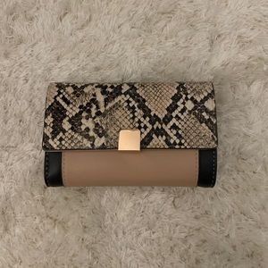 Tan and black snakeskin wallet